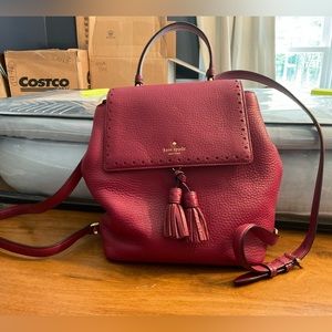 Kate Spade Tassel Flap Backpack in Burgundy